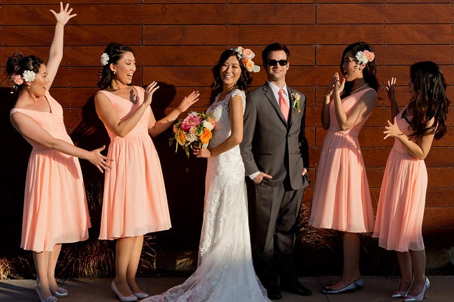 The couple and bridesmaids striking a pose at a vinery in Temecula